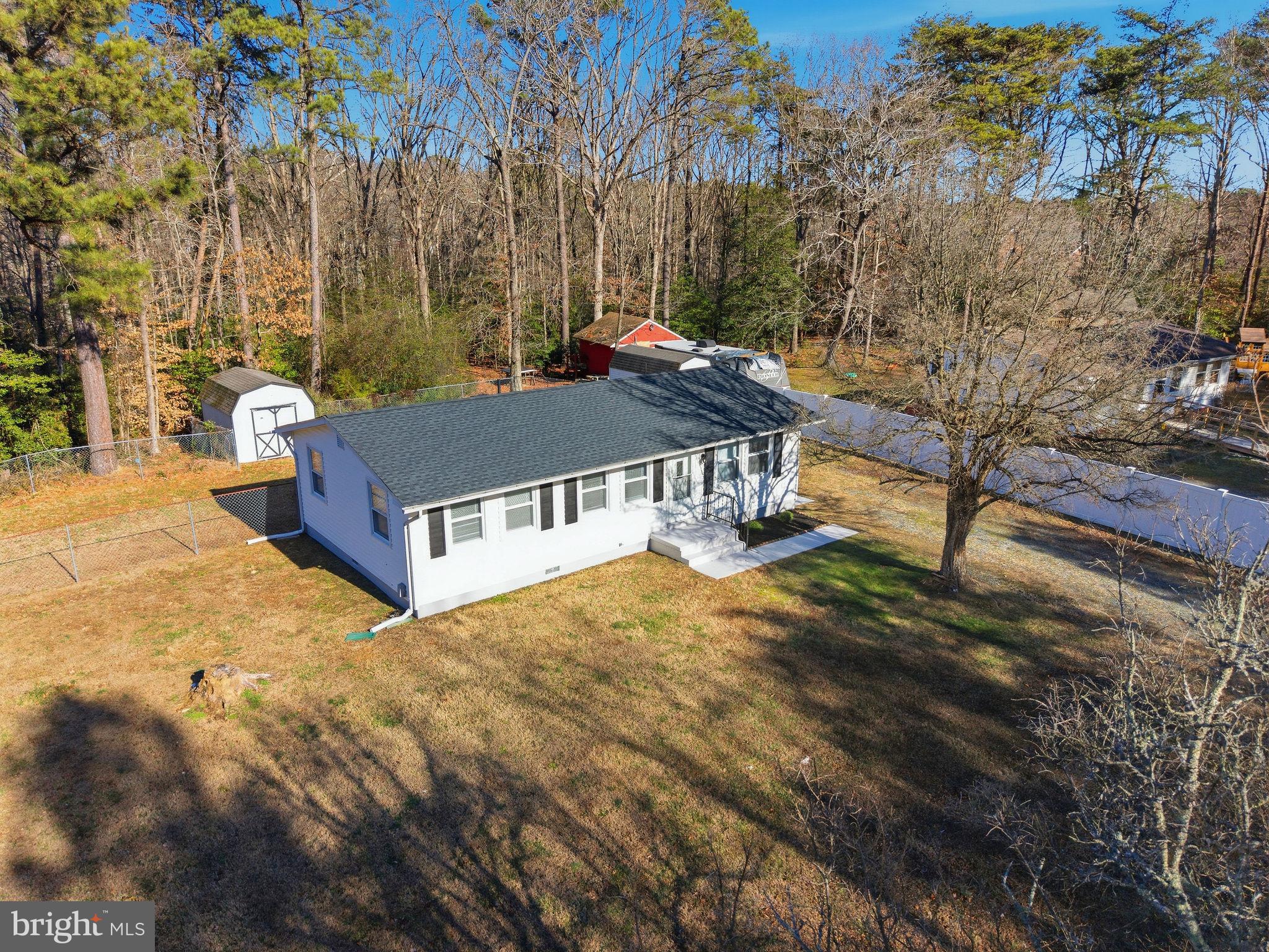 13108 Joy Road Lusby, MD 20657 - Photo 29 of 40 a view of a house with a yard and sitting area