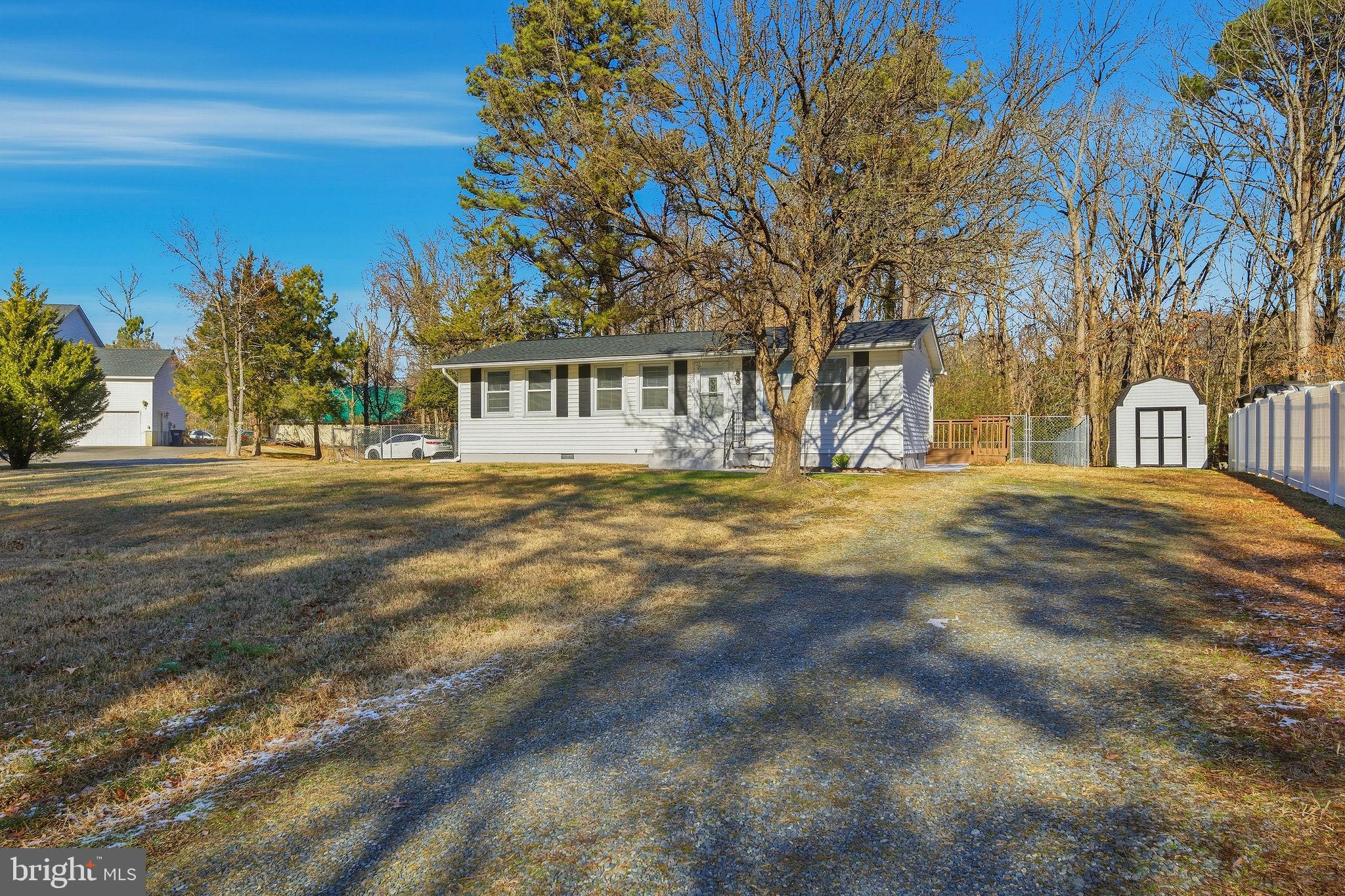 13108 Joy Road Lusby, MD 20657 - Photo 34 of 40 a front view of a house with a yard