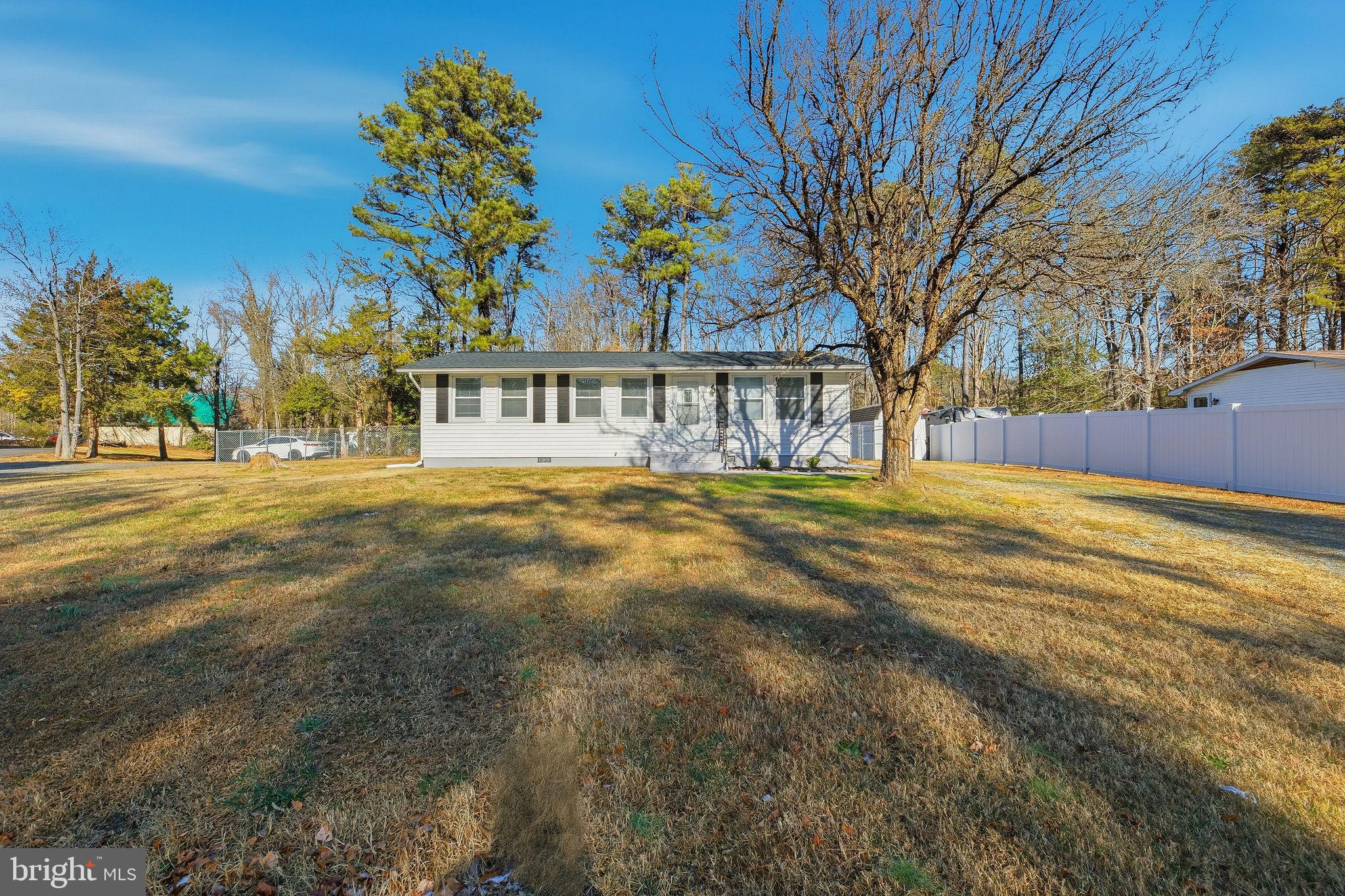 13108 Joy Road Lusby, MD 20657 - Photo 39 of 40 a view of a house with a yard