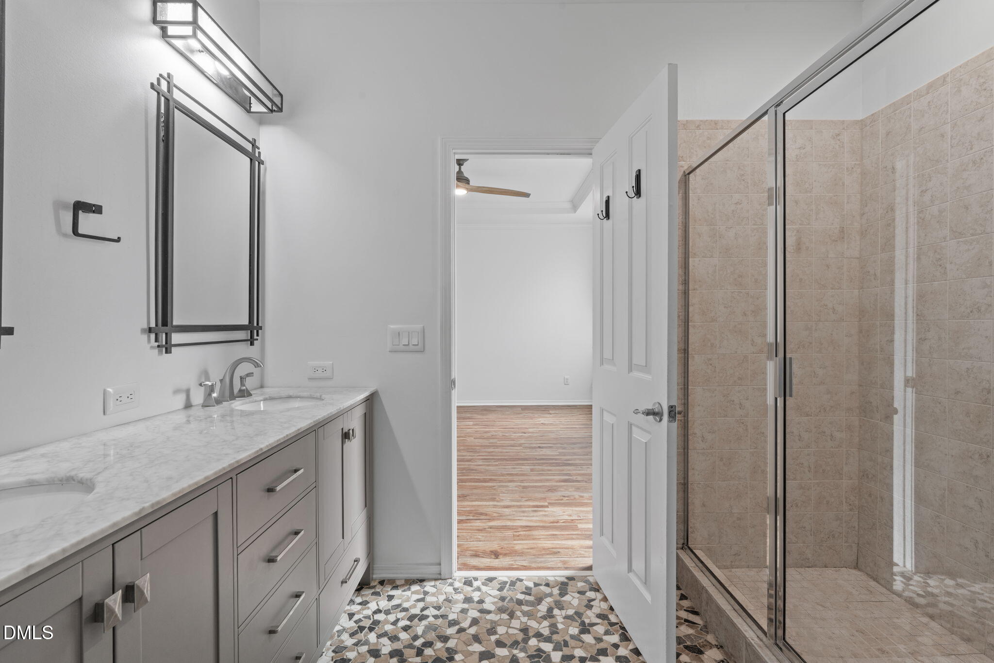 124 Daneborg Road Durham, NC 27703 - Photo 13 of 40 a bathroom with a granite countertop sink a mirror and shower