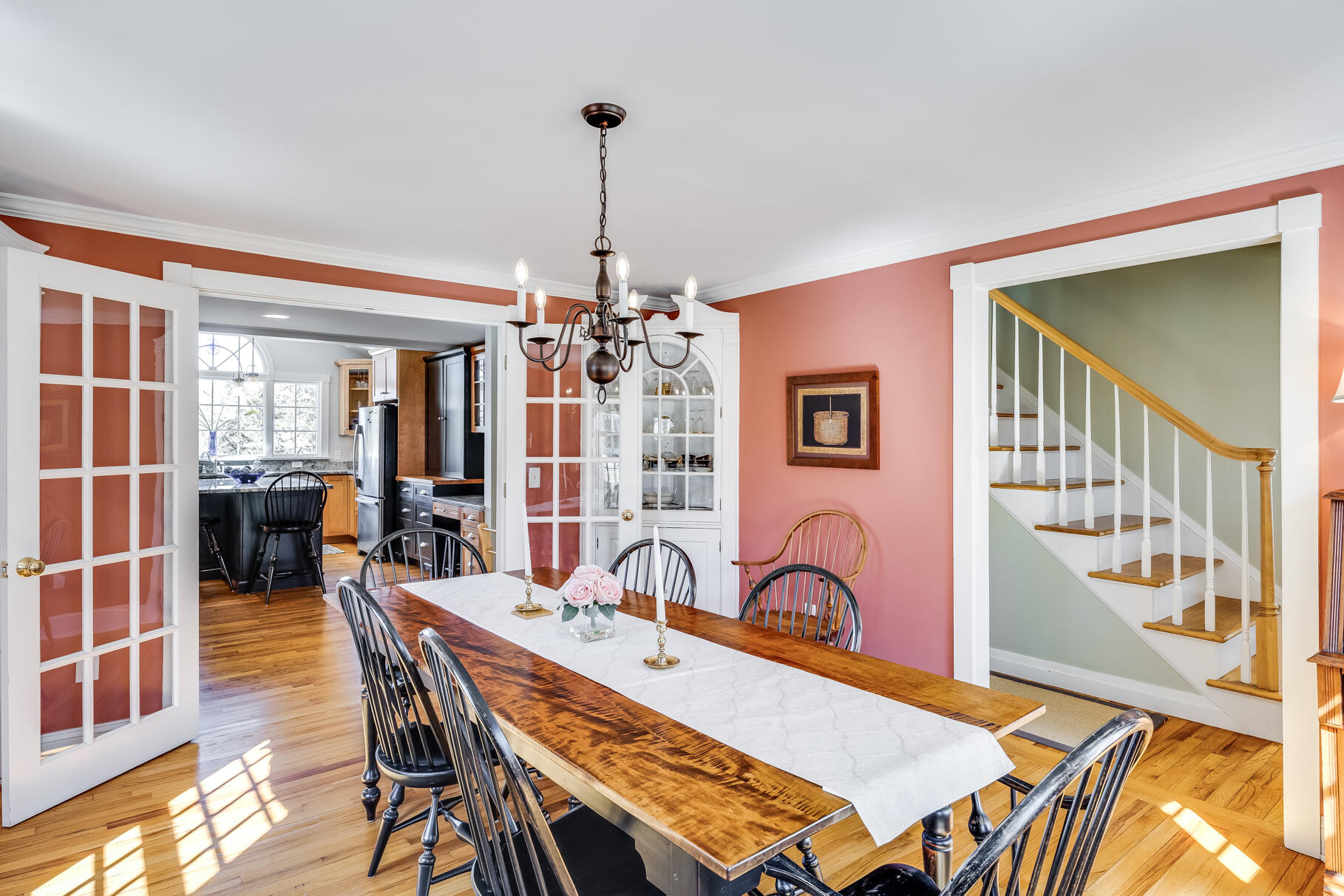 30 Beach Road Orleans, MA 02653 - Photo 21 of 76 a view of a dining room and livingroom with furniture wooden floor a chandelier