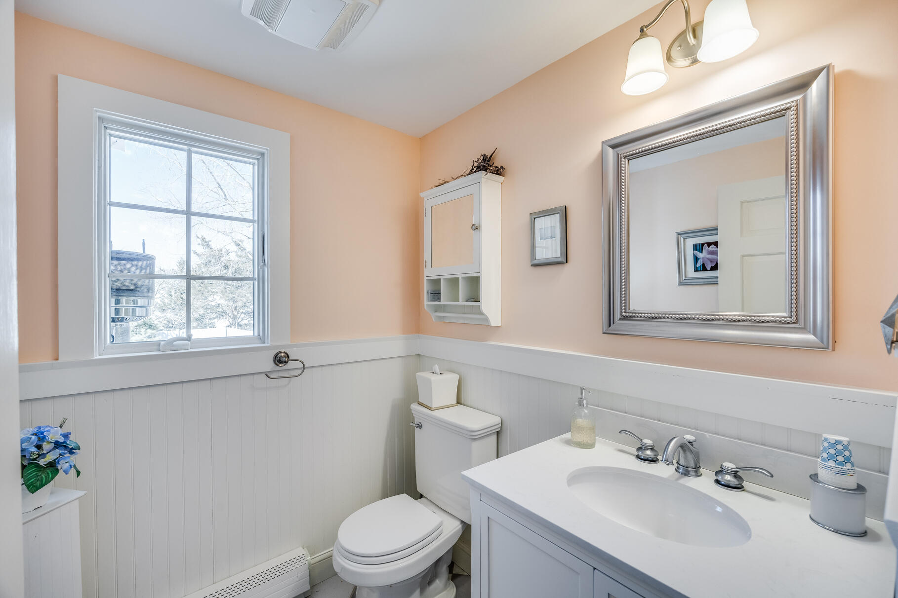 30 Beach Road Orleans, MA 02653 - Photo 39 of 76 a bathroom with a sink vanity mirror and toilet