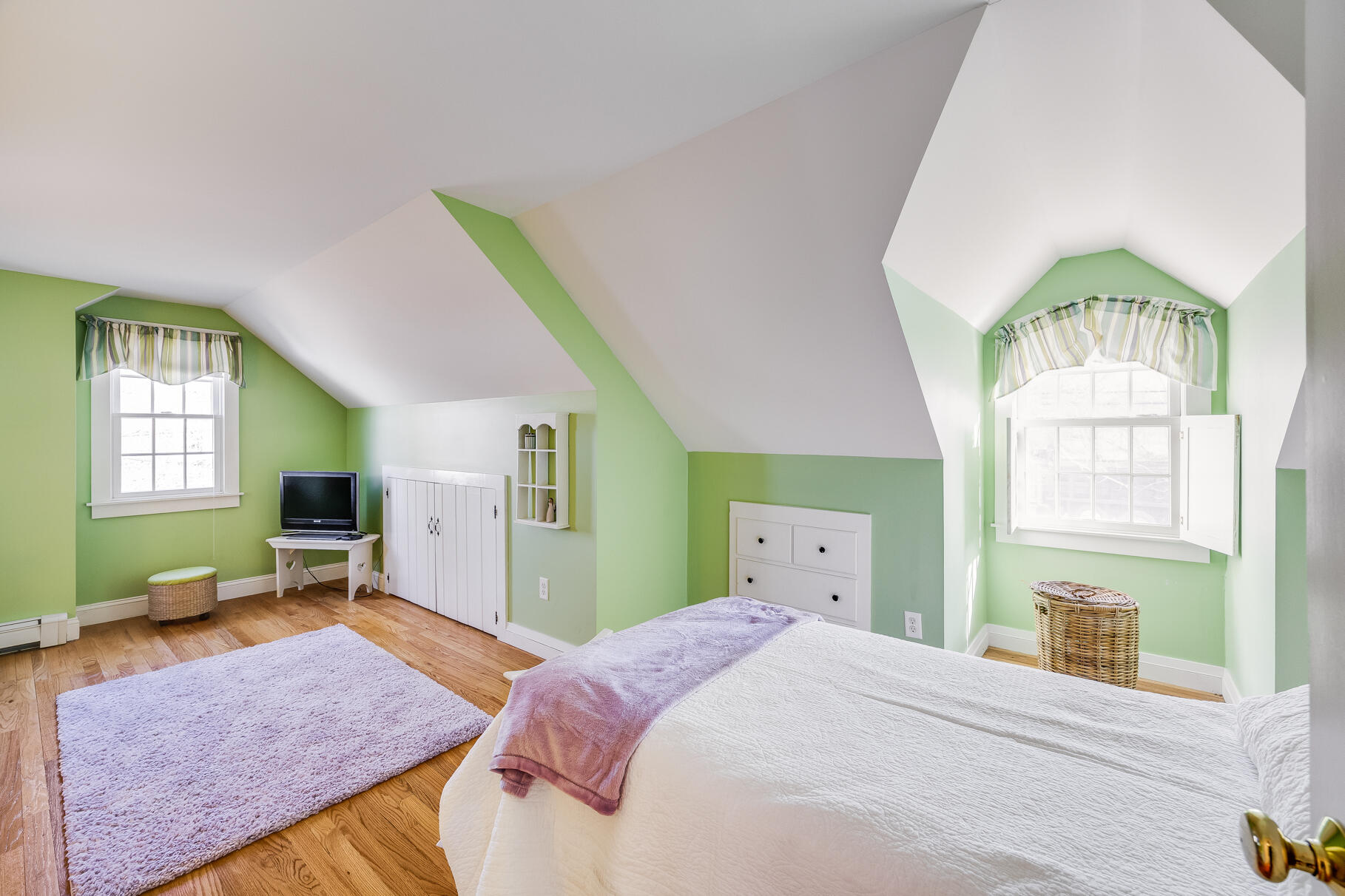 30 Beach Road Orleans, MA 02653 - Photo 44 of 76 a bedroom with a bed and wooden floor