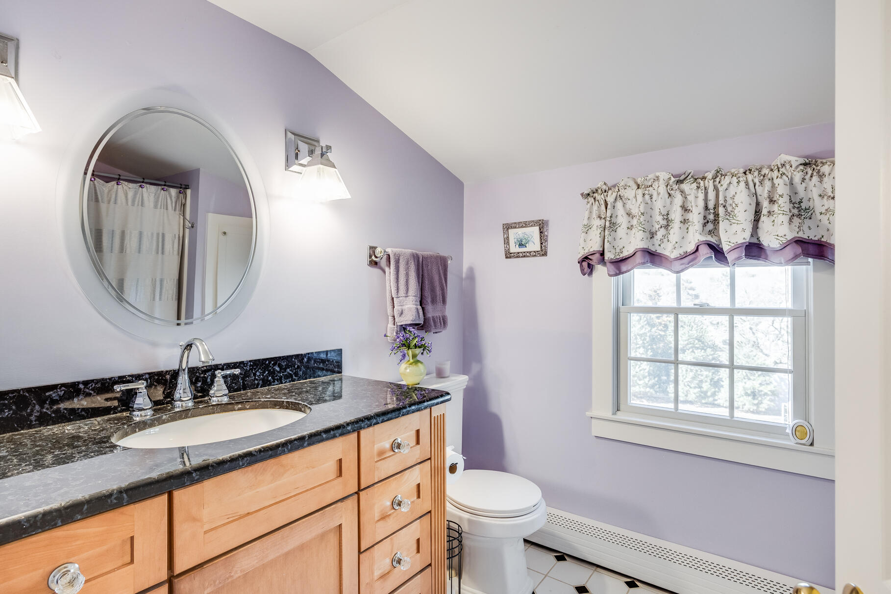 30 Beach Road Orleans, MA 02653 - Photo 46 of 76 a bathroom with a granite countertop toilet a sink and a mirror