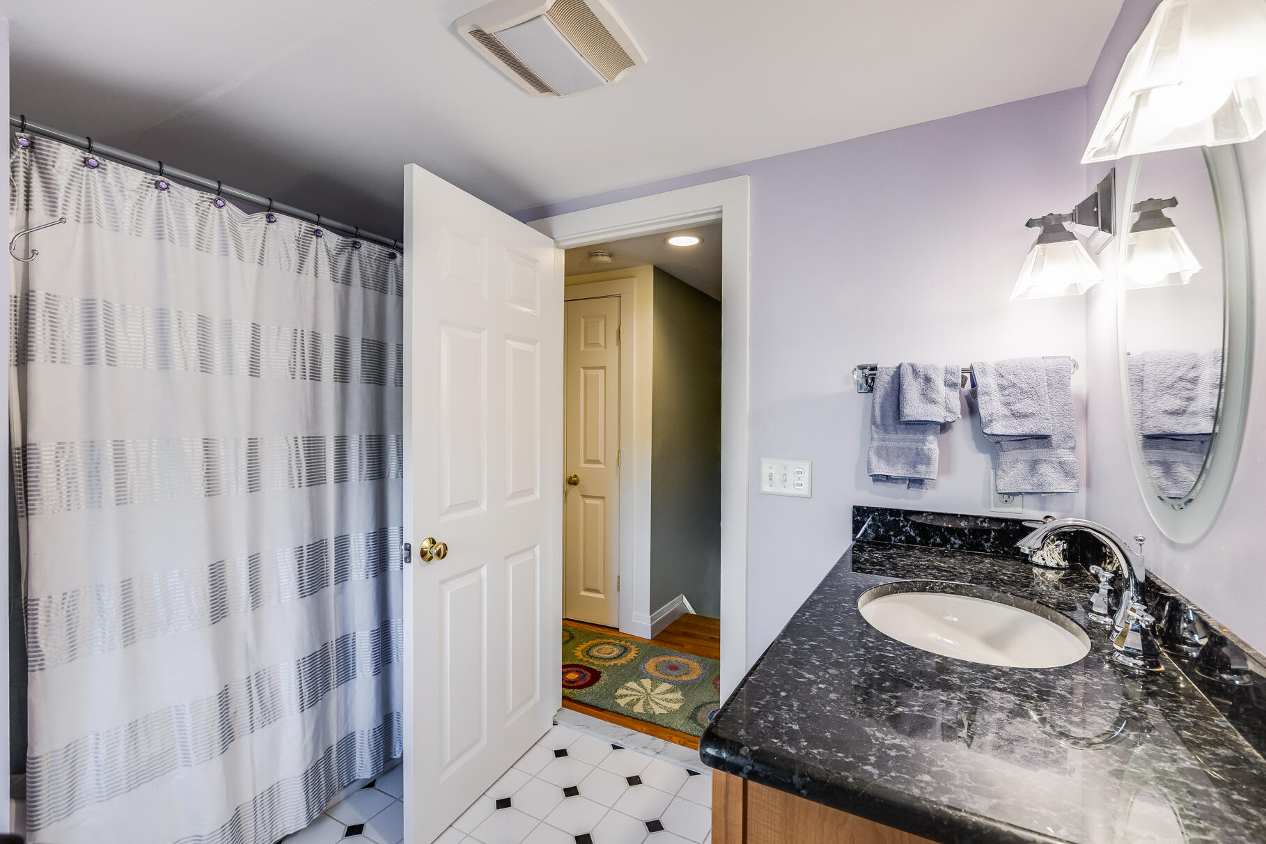 30 Beach Road Orleans, MA 02653 - Photo 47 of 76 a bathroom with a granite countertop sink and a mirror