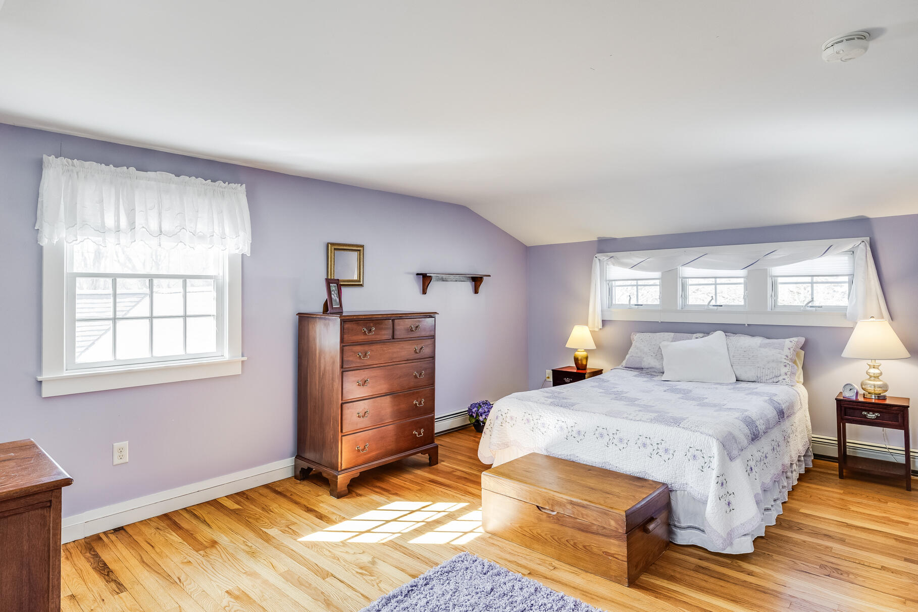 30 Beach Road Orleans, MA 02653 - Photo 51 of 76 a bedroom with a bed and wooden floor