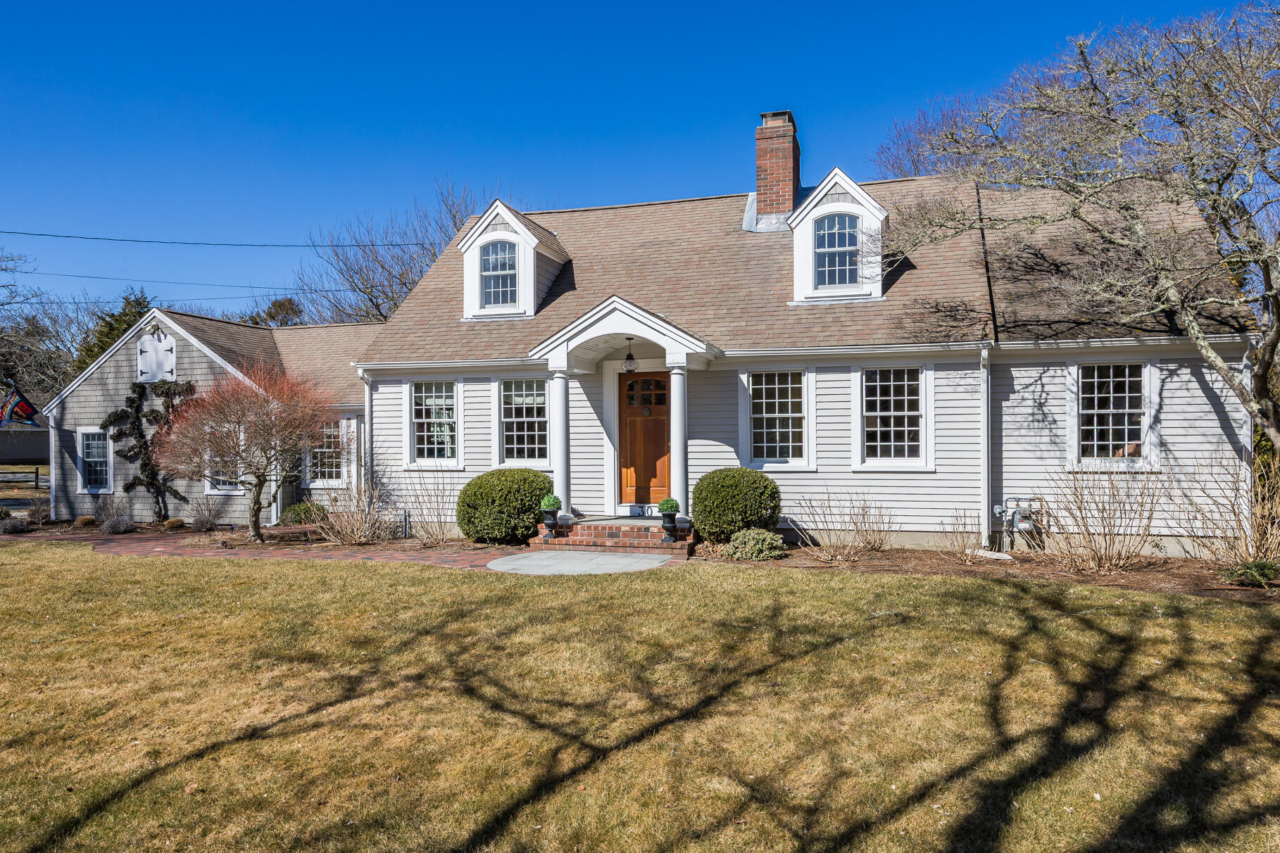 30 Beach Road Orleans, MA 02653 - Photo 55 of 76 a front view of a house with a yard