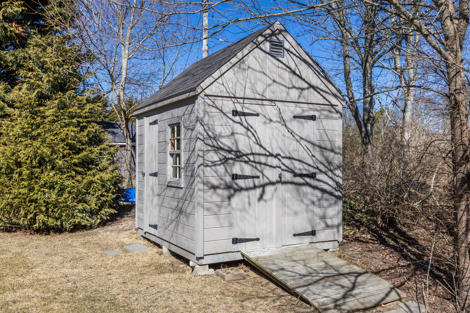 30 Beach Road Orleans, MA 02653 - Photo 57 of 76 a backyard of a house with lots of green space