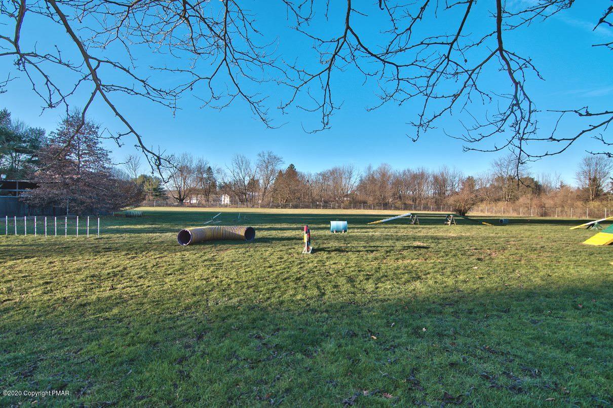 526 Weir Mountain Road Gilbert, PA 18331 - Photo 123 of 127 a backyard of a house with lots of green space and lake view