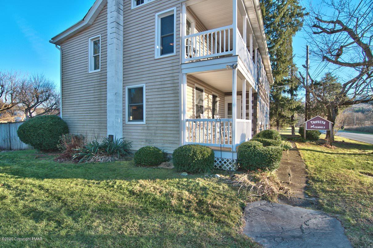 526 Weir Mountain Road Gilbert, PA 18331 - Photo 126 of 127 a front view of a house with garden