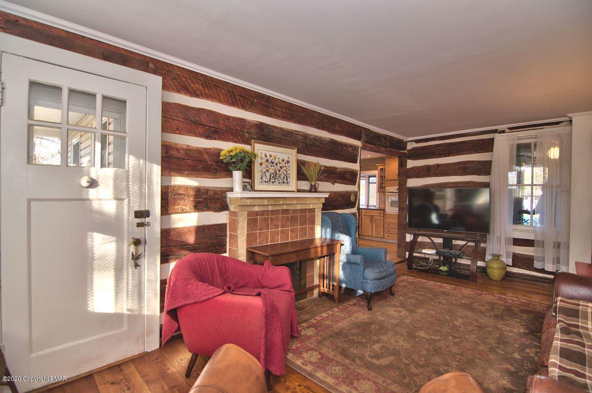 526 Weir Mountain Road Gilbert, PA 18331 - Photo 19 of 127 a living room with furniture and a flat screen tv