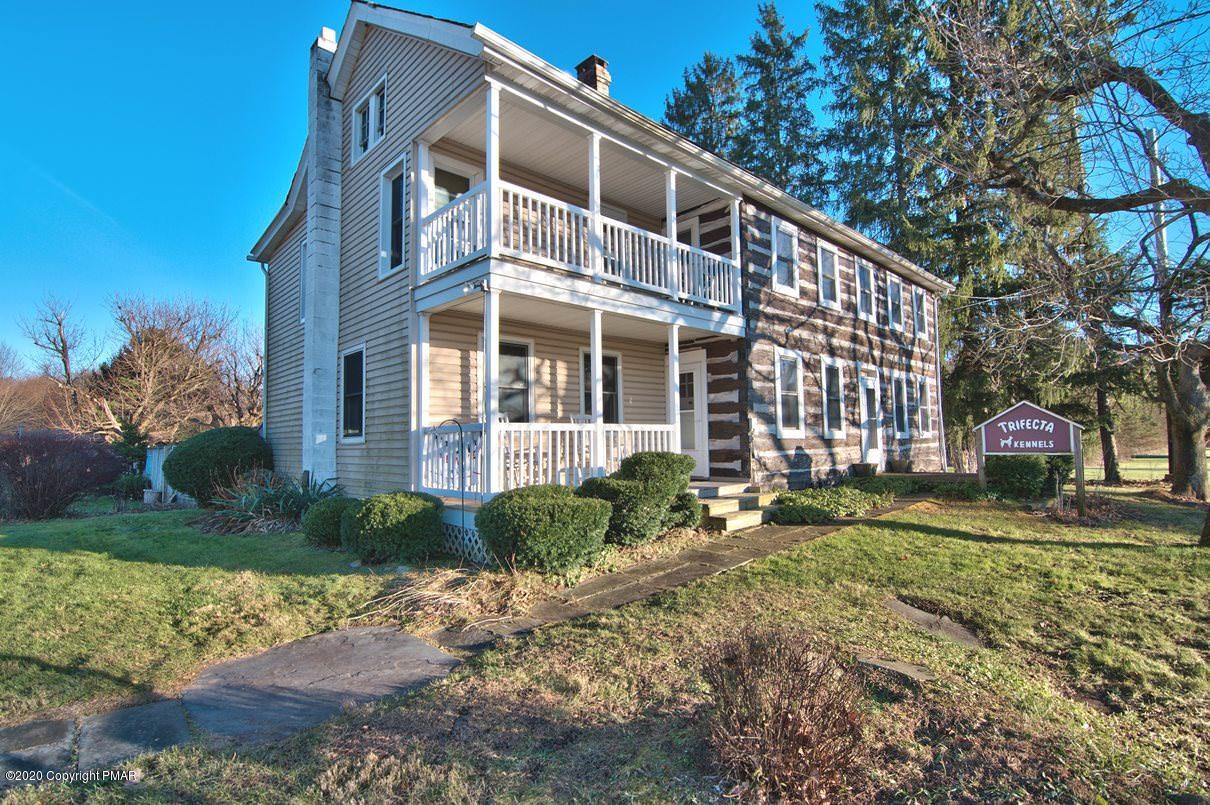 526 Weir Mountain Road Gilbert, PA 18331 - Photo 2 of 127 a front view of a house with a yard