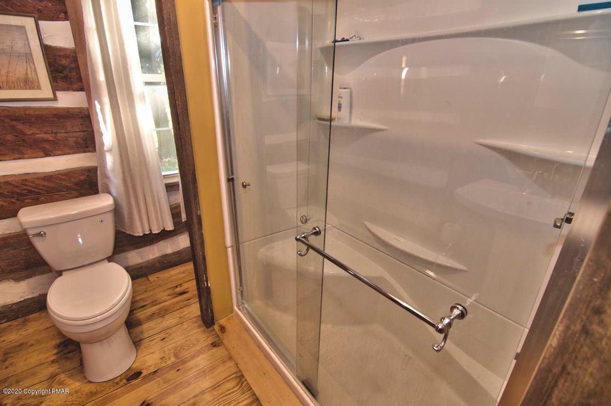 526 Weir Mountain Road Gilbert, PA 18331 - Photo 23 of 127 a bathroom with a toilet and a shower