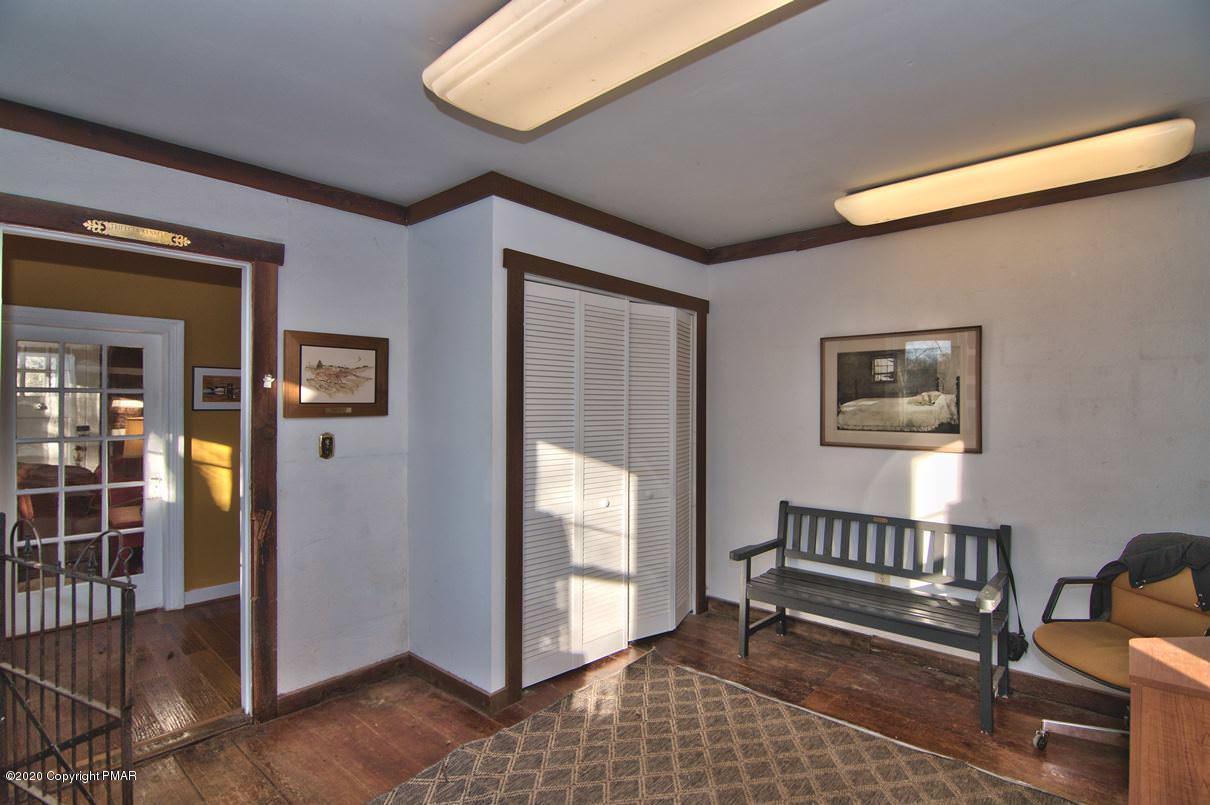 526 Weir Mountain Road Gilbert, PA 18331 - Photo 28 of 127 a view of a hallway with wooden floor and furniture