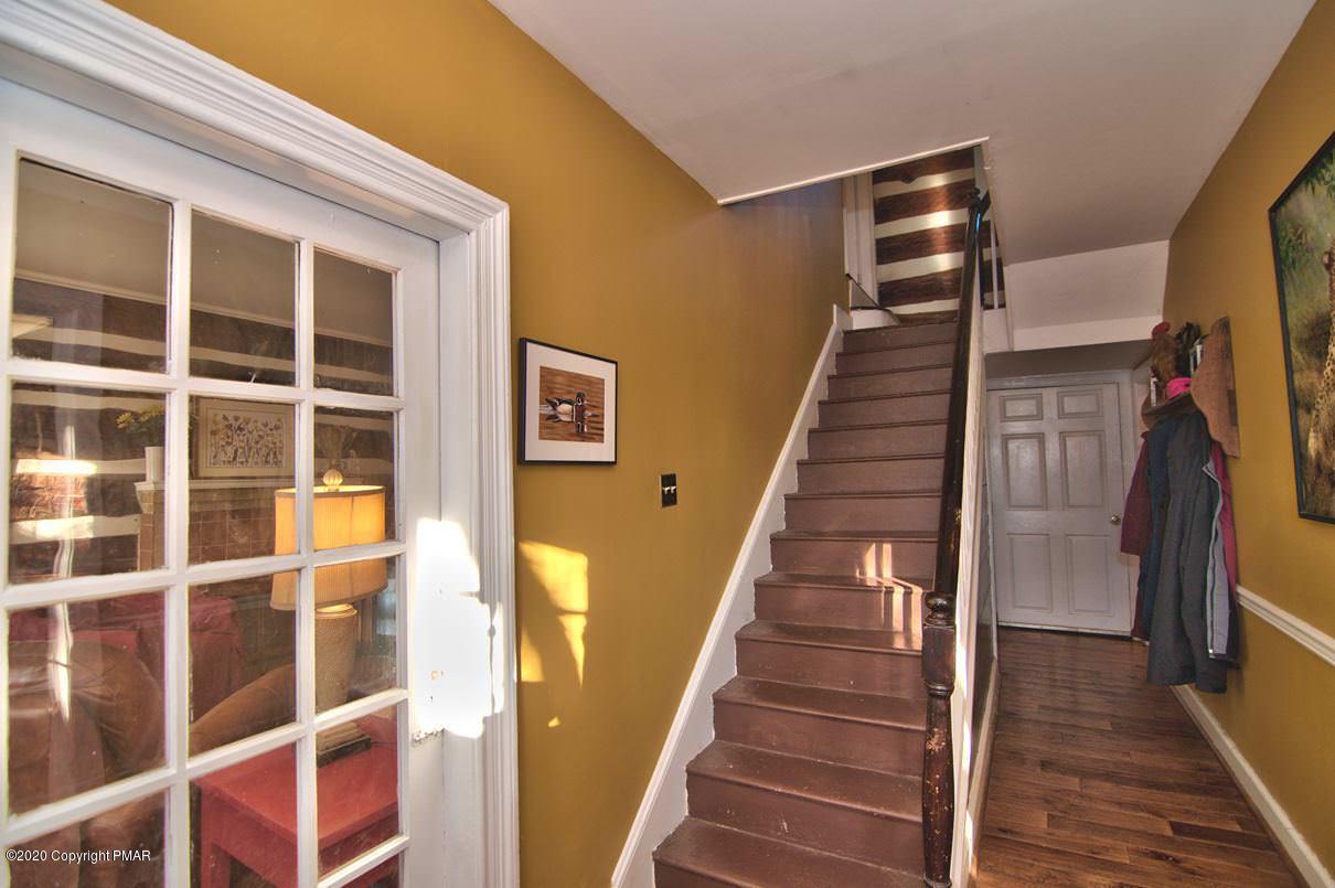 526 Weir Mountain Road Gilbert, PA 18331 - Photo 29 of 127 a view of staircase with wooden floor and windows