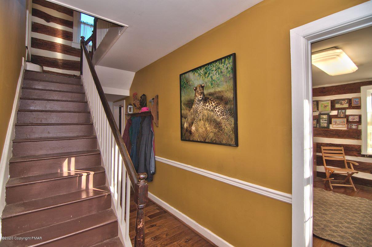 526 Weir Mountain Road Gilbert, PA 18331 - Photo 30 of 127 a view of staircase with wooden floor and white walls