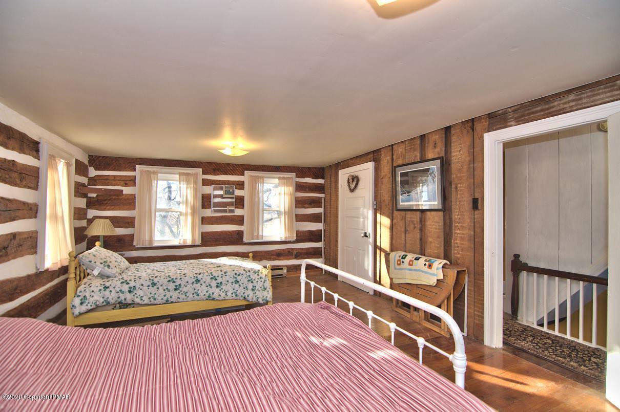 526 Weir Mountain Road Gilbert, PA 18331 - Photo 47 of 127 a view of a bedroom with furniture and staircase