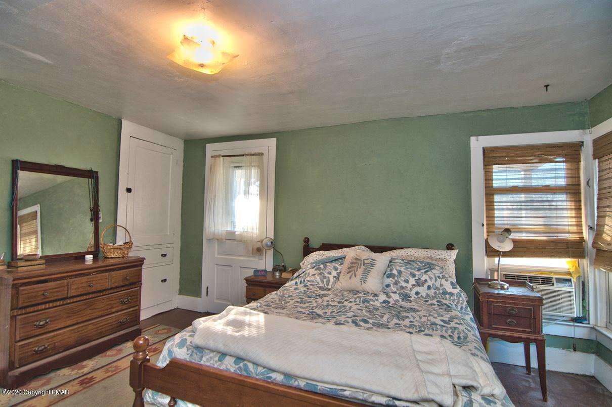 526 Weir Mountain Road Gilbert, PA 18331 - Photo 58 of 127 a bedroom with a bed and a dresser in it