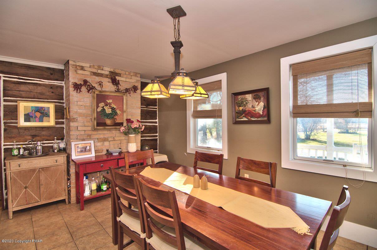 526 Weir Mountain Road Gilbert, PA 18331 - Photo 6 of 127 a view of a dining room with furniture window and wooden floor