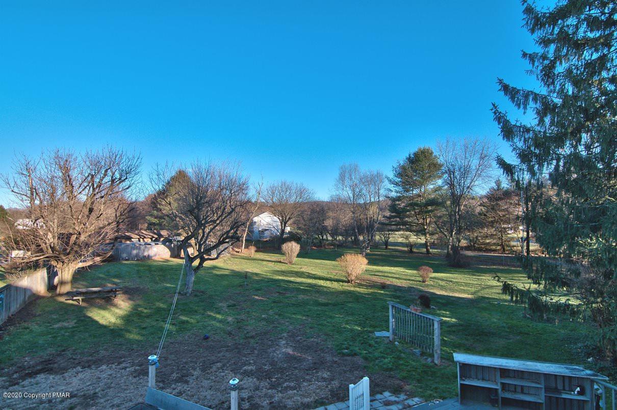 526 Weir Mountain Road Gilbert, PA 18331 - Photo 68 of 127 a view of a golf course with a lake