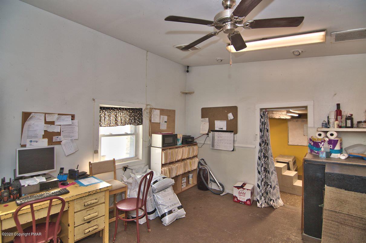 526 Weir Mountain Road Gilbert, PA 18331 - Photo 86 of 127 a bedroom with furniture a window and gym equipment