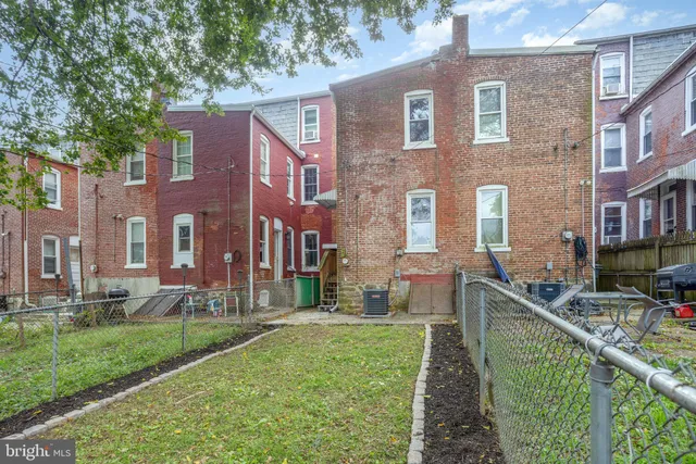 a view of a brick building with many windows