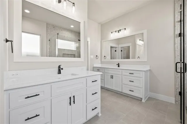 a bathroom with a granite countertop sink mirror and