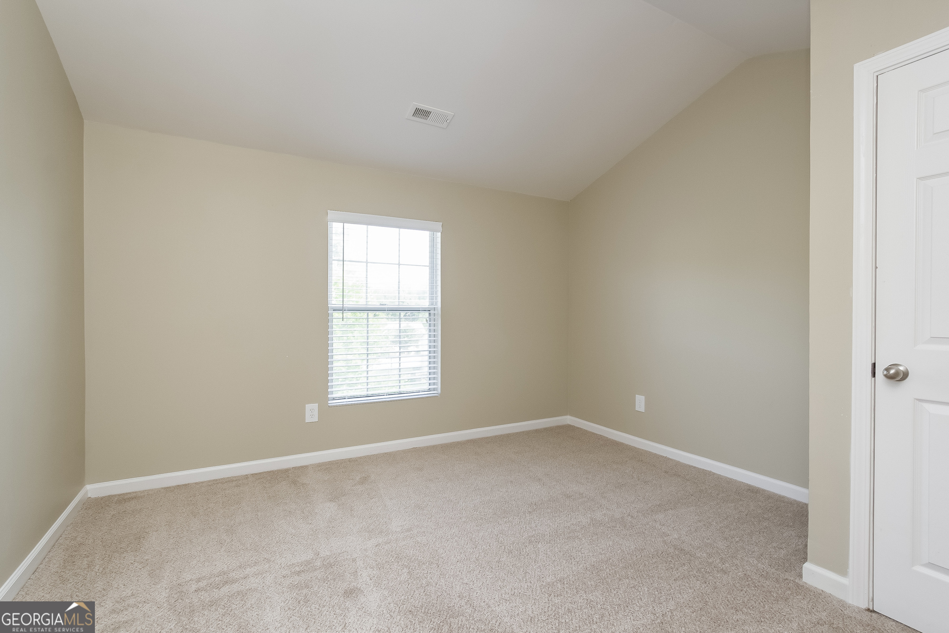 5892 Village Loop Fairburn, GA 30213 - Photo 11 of 15 an empty room with a window