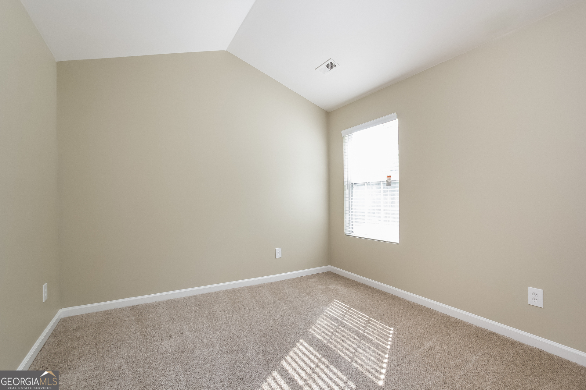 5892 Village Loop Fairburn, GA 30213 - Photo 12 of 15 an empty room with a window
