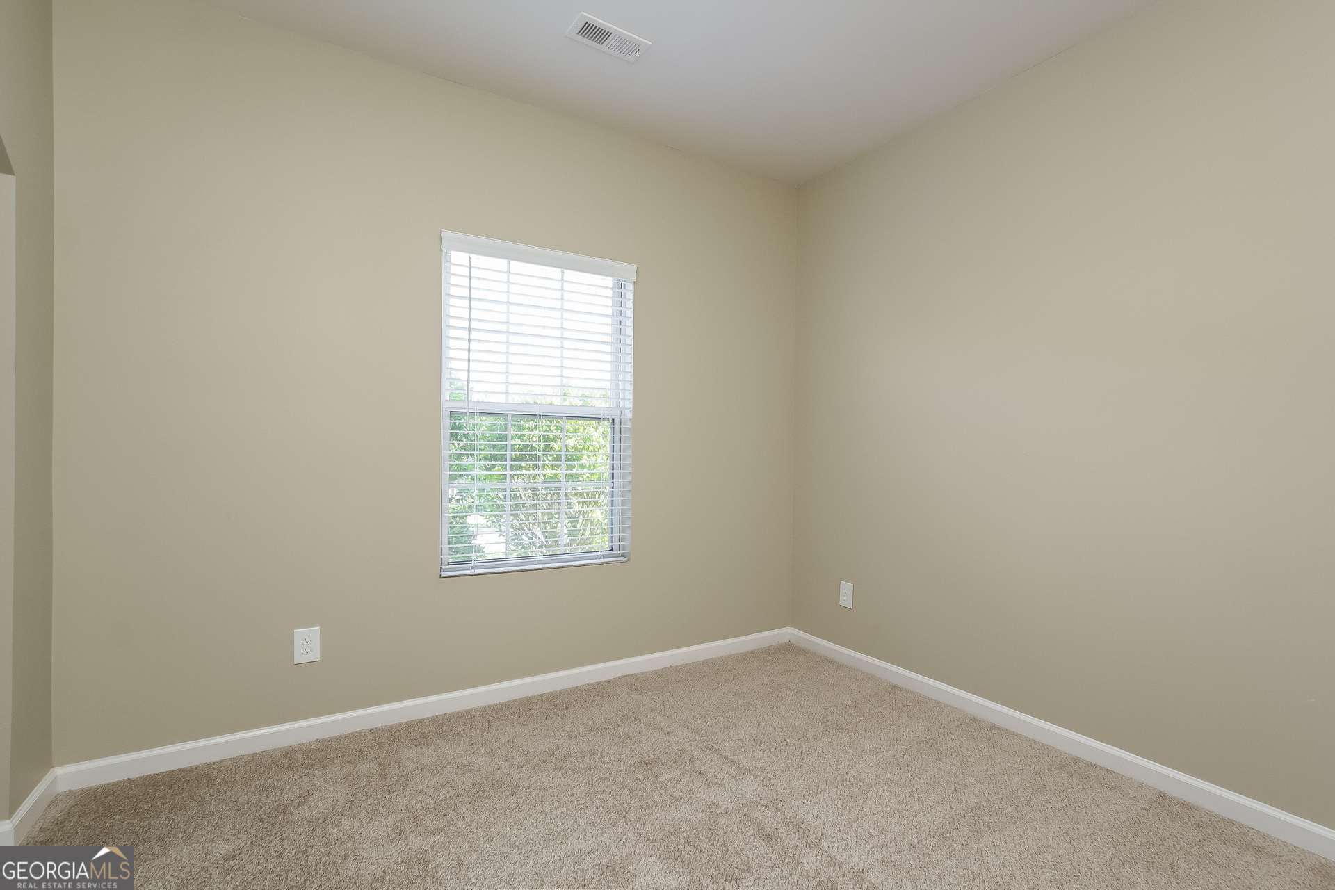 5892 Village Loop Fairburn, GA 30213 - Photo 7 of 15 an empty room with a window