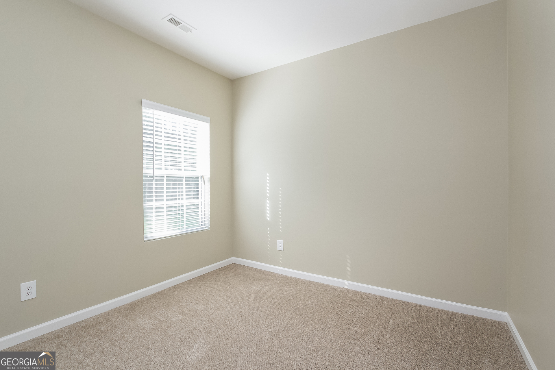 5892 Village Loop Fairburn, GA 30213 - Photo 8 of 15 an empty room with a window