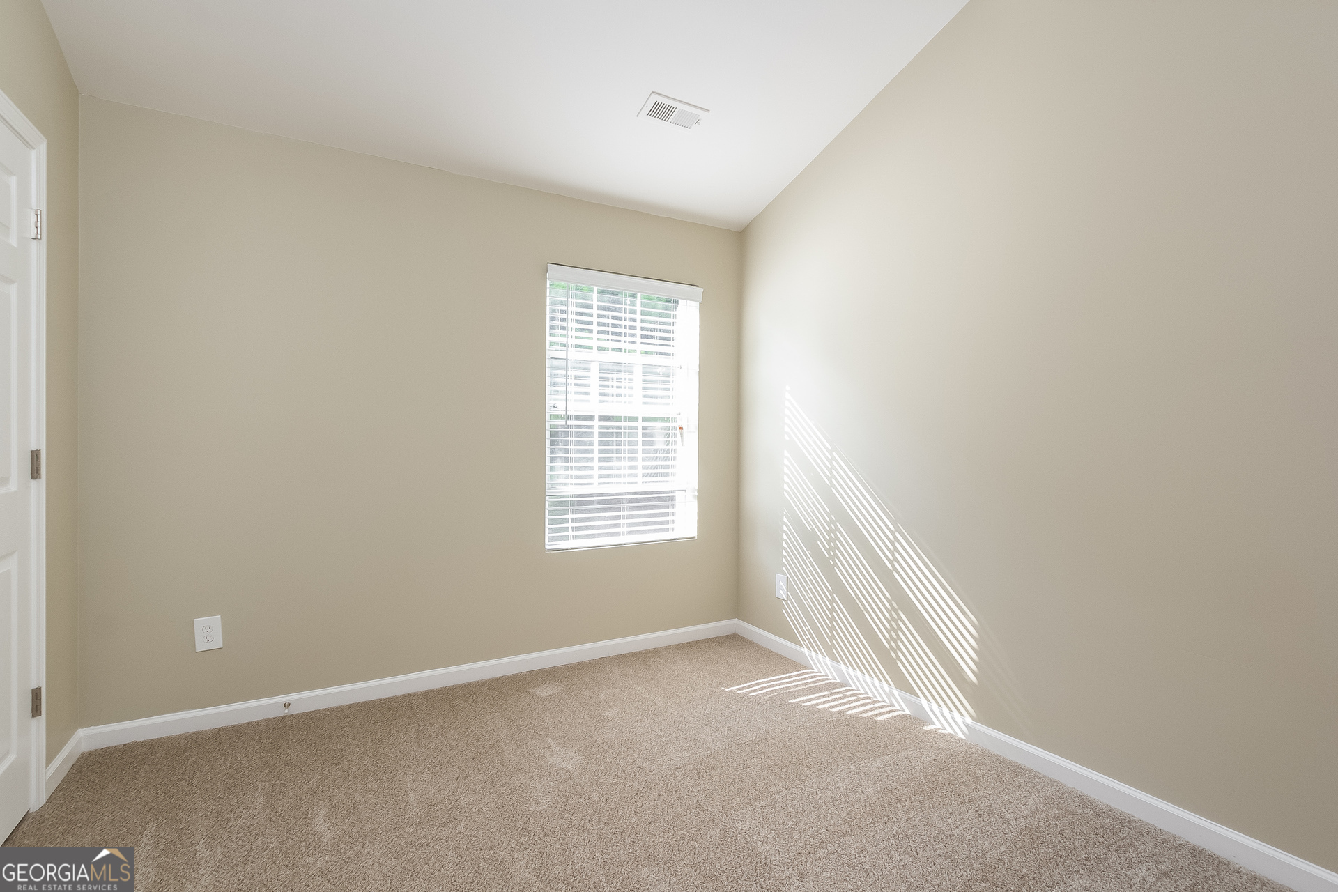 5892 Village Loop Fairburn, GA 30213 - Photo 9 of 15 an empty room with a window