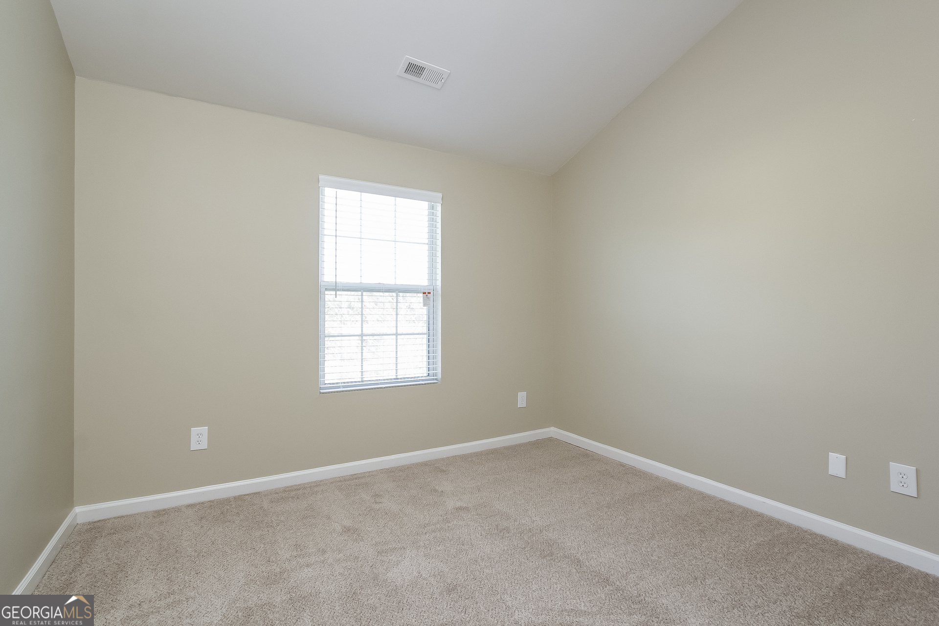 5892 Village Loop Fairburn, GA 30213 - Photo 10 of 15 an empty room with a window