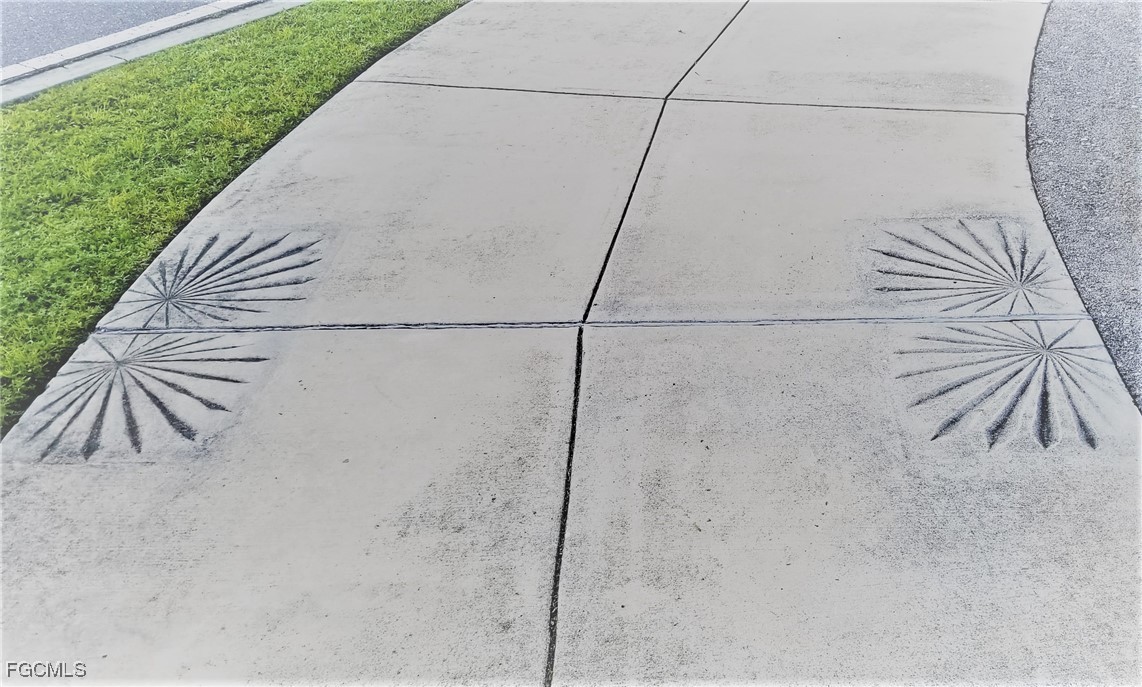 1128226043 Crimson Glory Road North Port, FL 34288 - Photo 9 of 43 a view of a dry yard with wooden fence