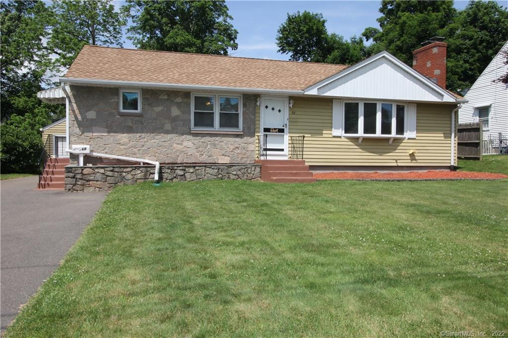 68 Oakwood Road Manchester, CT 06042 - Photo 1 of 1 a front view of a house with a yard