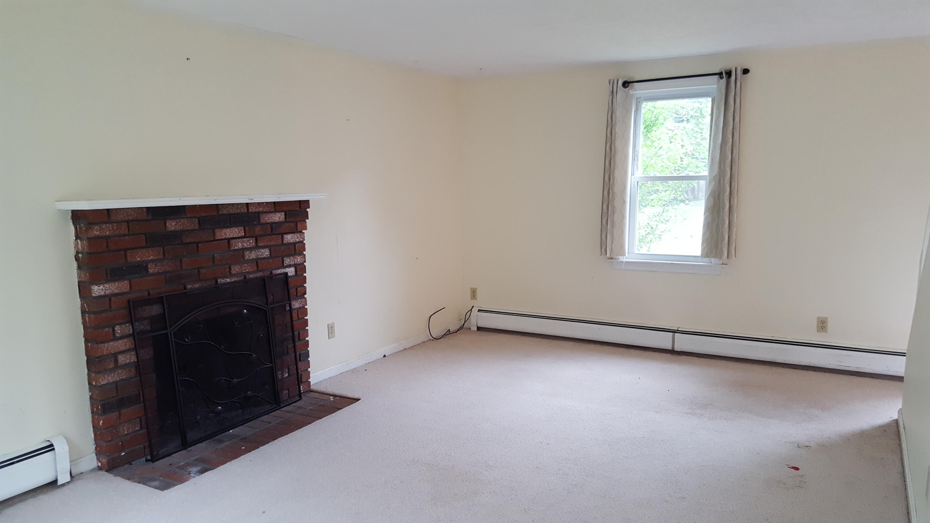 9 Pebble Path Forestdale, MA 02644 - Photo 12 of 21 a view of an empty room with a fireplace and a window