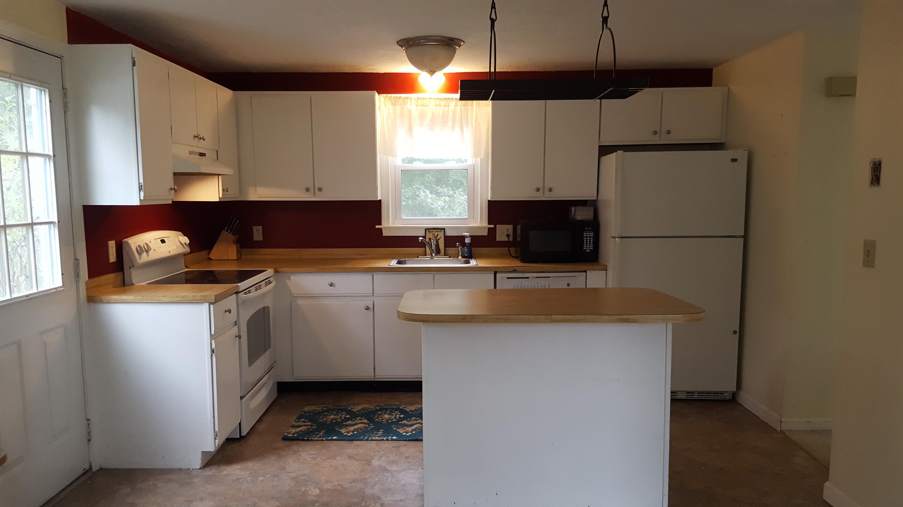 9 Pebble Path Forestdale, MA 02644 - Photo 8 of 21 a kitchen with a sink a stove a refrigerator and cabinets