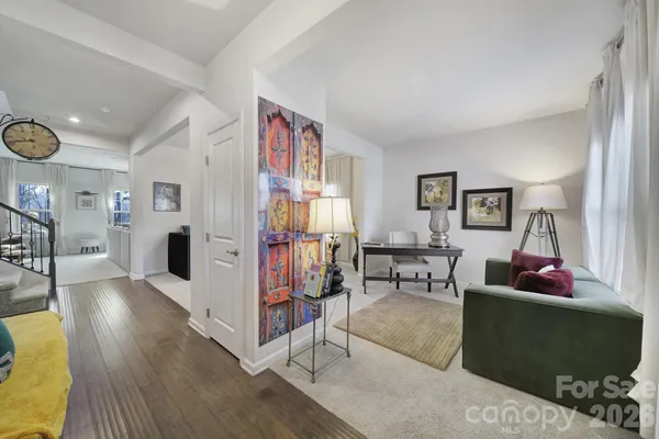 a bedroom with furniture and wooden floor