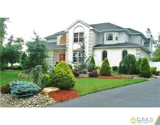 7 Gramercy Road Monmouth Junction, NJ 08852 - Photo 1 of 25 a black and white house with a yard