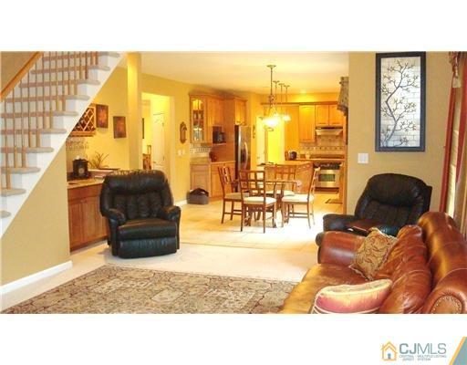 7 Gramercy Road Monmouth Junction, NJ 08852 - Photo 14 of 25 a living room with furniture and a floor to ceiling window