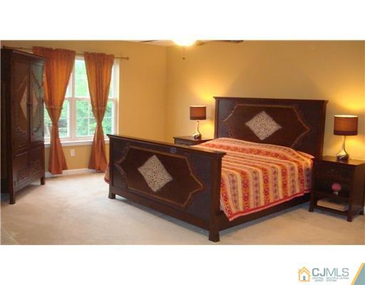 7 Gramercy Road Monmouth Junction, NJ 08852 - Photo 17 of 25 a bedroom with a bed and window