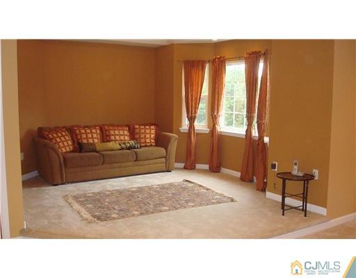7 Gramercy Road Monmouth Junction, NJ 08852 - Photo 18 of 25 a living room with furniture and a window