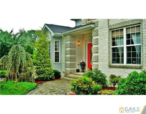 7 Gramercy Road Monmouth Junction, NJ 08852 - Photo 3 of 25 a front view of a house with a yard