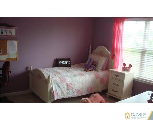 7 Gramercy Road Monmouth Junction, NJ 08852 - Photo 21 of 25 a living room with furniture and a window