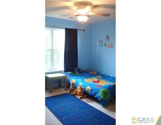 7 Gramercy Road Monmouth Junction, NJ 08852 - Photo 22 of 25 a bedroom with a bed and a window