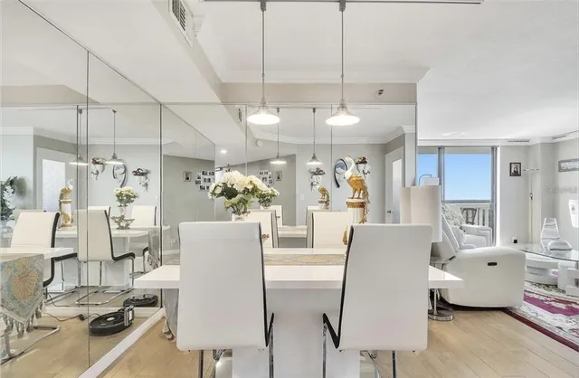 a living room with lots of furniture and a chandelier