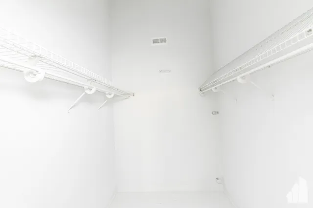 a bathroom with a toilet sink and shower