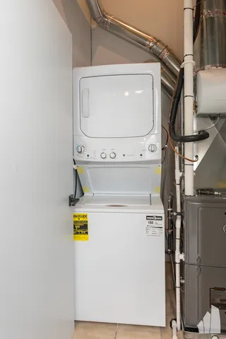 a view of a balcony with wooden floor and iron stairs