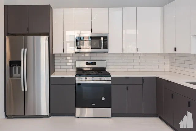 a kitchen with stainless steel appliances granite countertop a refrigerator stove a sink and dishwasher