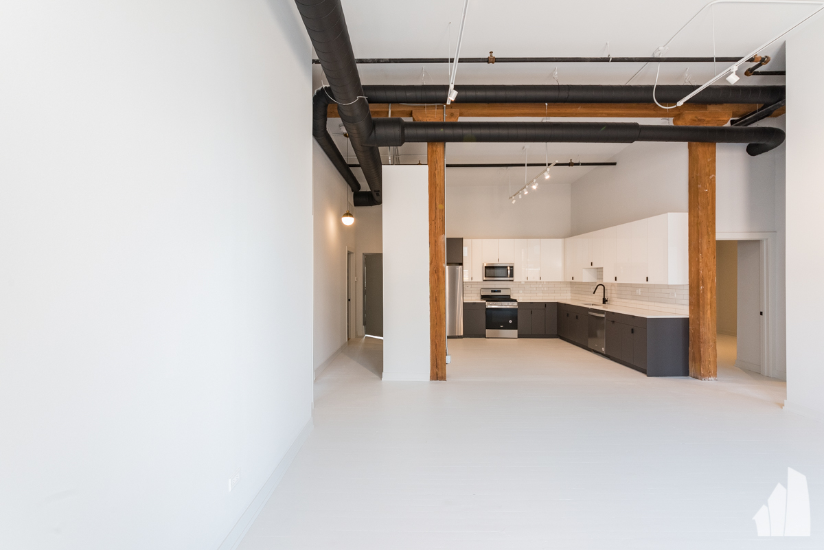 213 North Racine Avenue, Unit 305 Chicago, IL 60607 - Photo 8 of 22 a view of a kitchen with a sink and cabinets